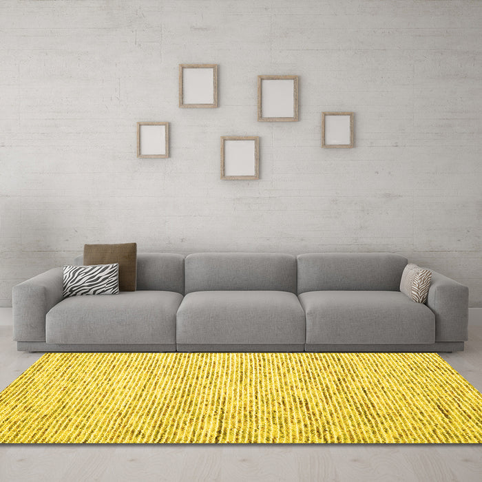 Machine Washable Solid Yellow Modern Rug in a Living Room, wshcon1852yw