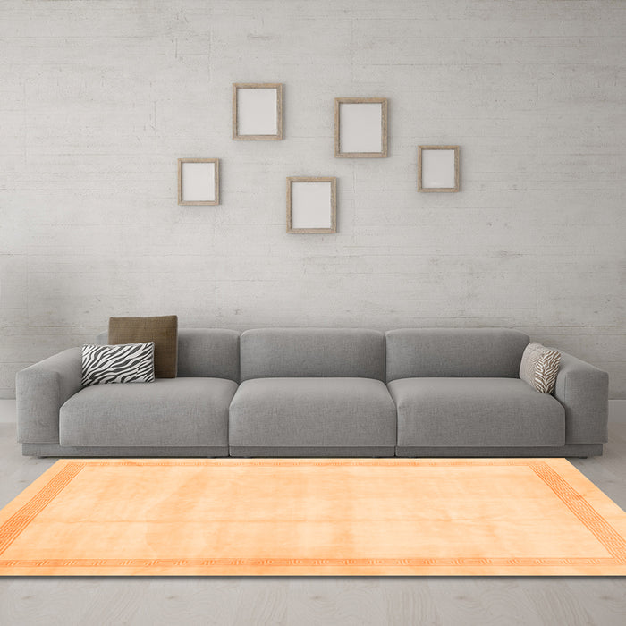 Machine Washable Solid Orange Modern Area Rugs in a Living Room, wshcon1886org
