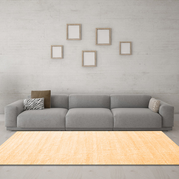 Machine Washable Solid Orange Modern Area Rugs in a Living Room, wshcon1894org