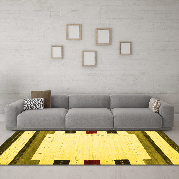 Machine Washable Solid Yellow Modern Rug in a Living Room, wshcon1911yw