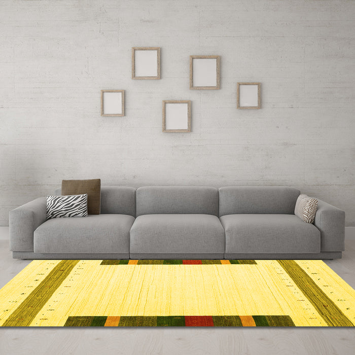 Machine Washable Solid Yellow Modern Rug in a Living Room, wshcon1916yw