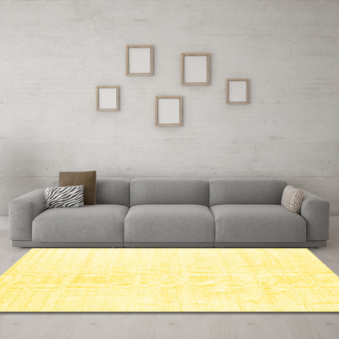 Machine Washable Solid Yellow Modern Rug in a Living Room, wshcon1922yw