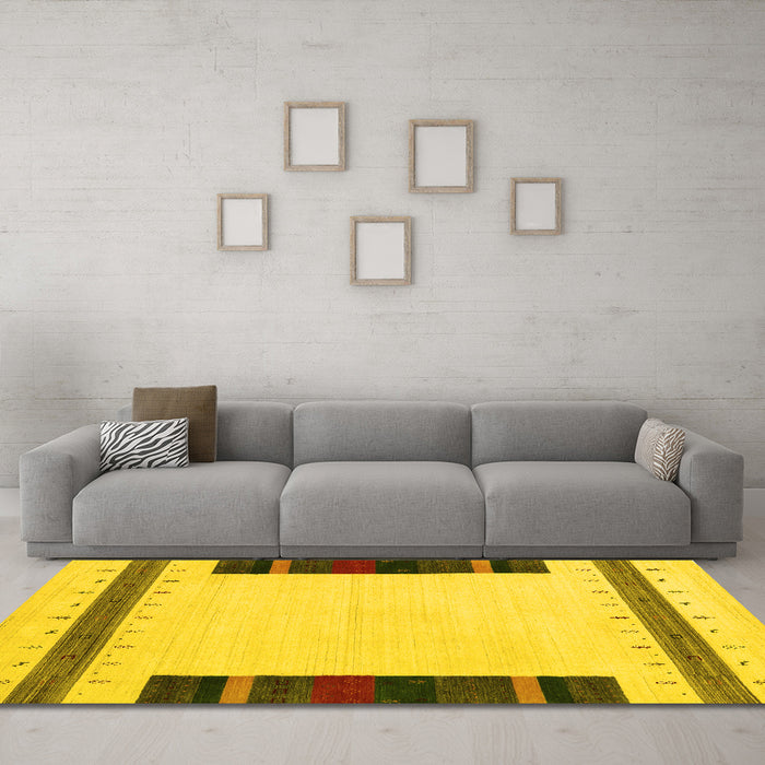 Machine Washable Solid Yellow Modern Rug in a Living Room, wshcon1928yw
