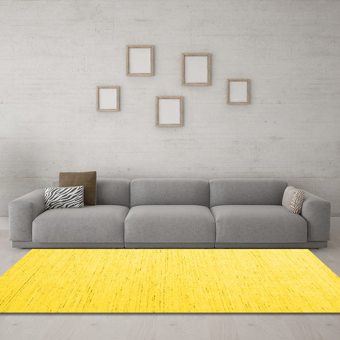 Machine Washable Solid Yellow Modern Rug in a Living Room, wshcon1929yw