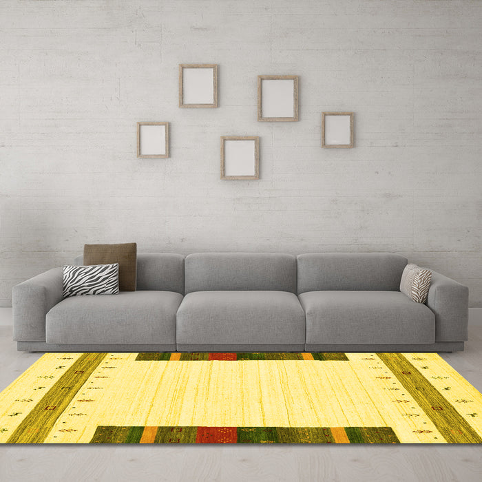 Machine Washable Solid Yellow Modern Rug in a Living Room, wshcon1967yw