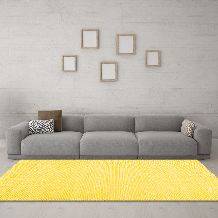 Machine Washable Solid Yellow Modern Rug in a Living Room, wshcon1981yw