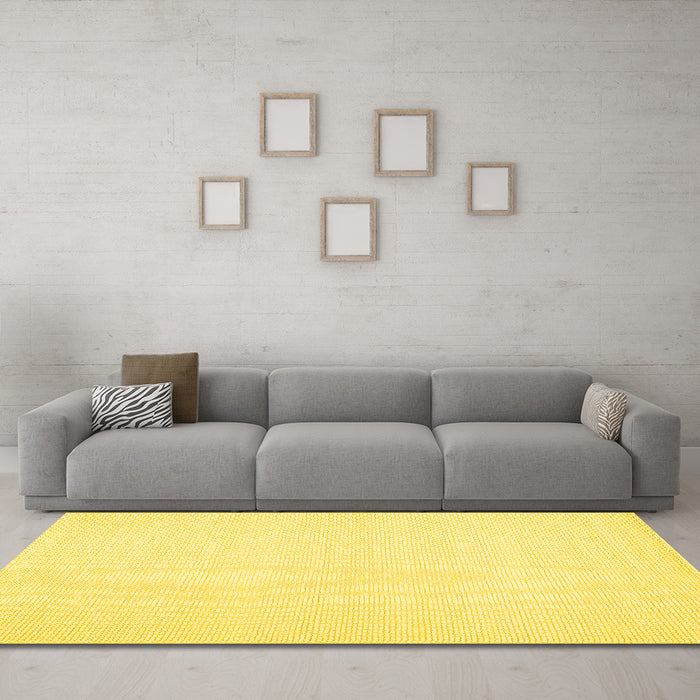 Machine Washable Solid Yellow Modern Rug in a Living Room, wshcon1983yw
