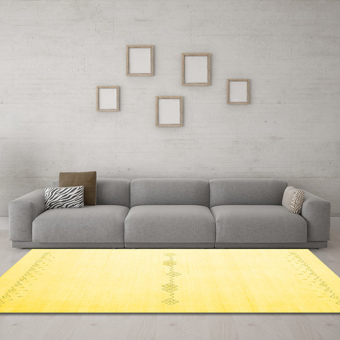 Machine Washable Solid Yellow Modern Rug in a Living Room, wshcon2029yw