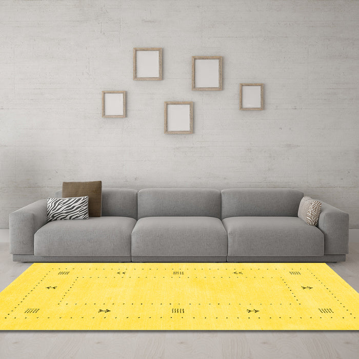 Machine Washable Solid Yellow Modern Rug in a Living Room, wshcon2037yw