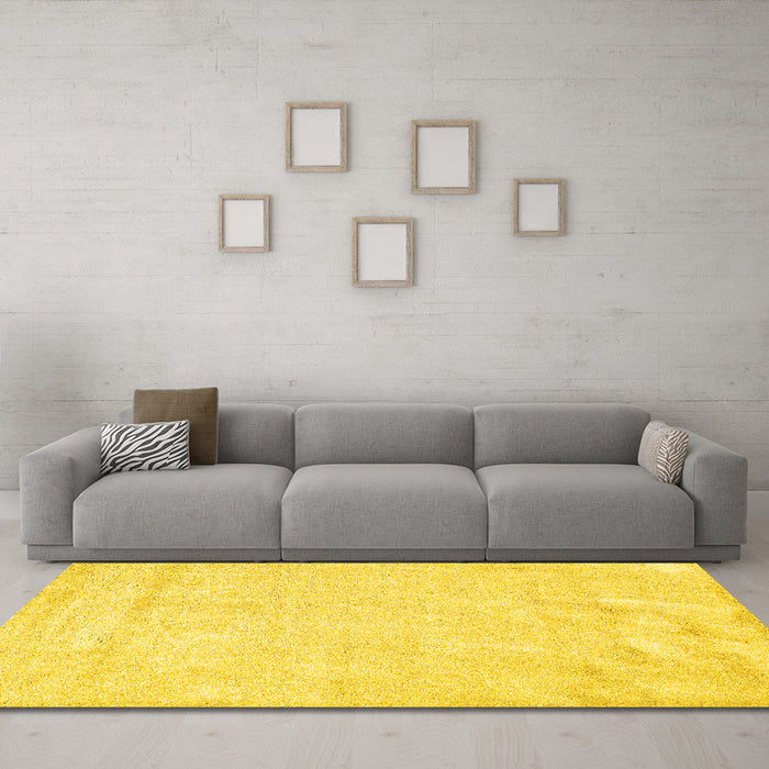Machine Washable Solid Yellow Modern Rug in a Living Room, wshcon2054yw