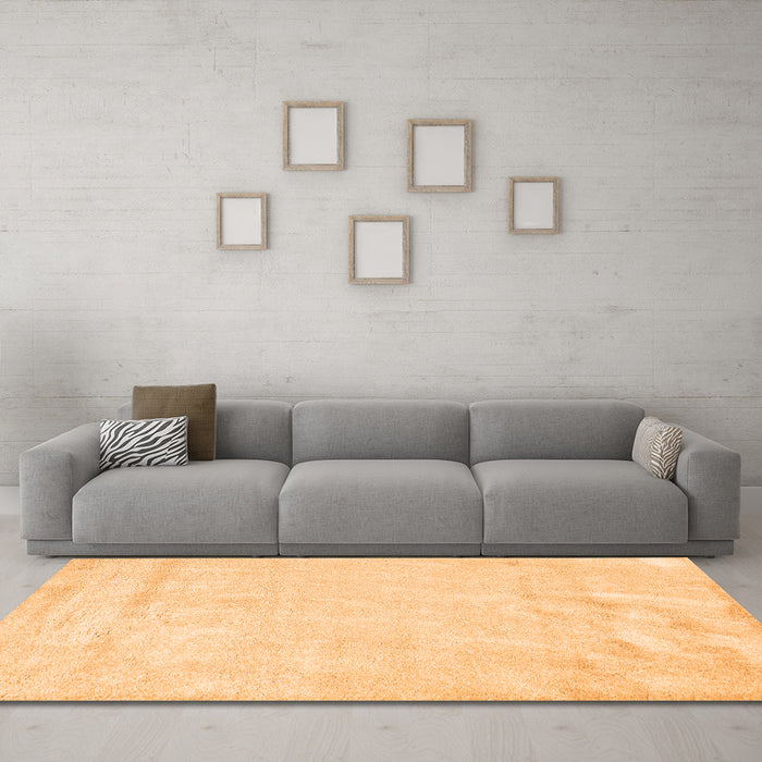 Machine Washable Solid Orange Modern Area Rugs in a Living Room, wshcon2054org