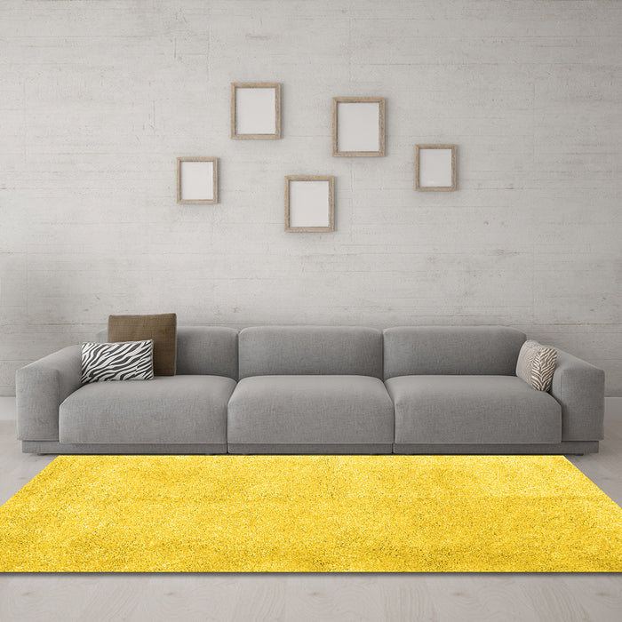 Machine Washable Solid Yellow Modern Rug in a Living Room, wshcon2055yw