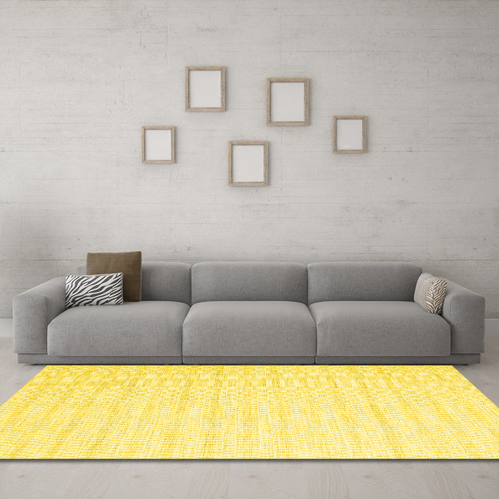 Machine Washable Solid Yellow Modern Rug in a Living Room, wshcon2116yw