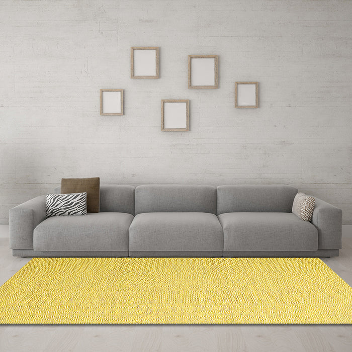 Machine Washable Solid Yellow Modern Rug in a Living Room, wshcon2160yw