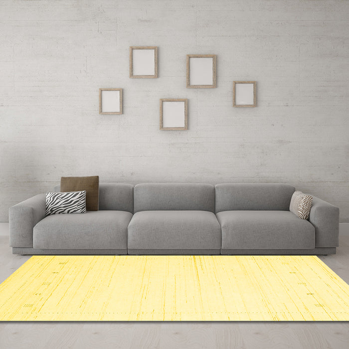Machine Washable Solid Yellow Modern Rug in a Living Room, wshcon2309yw