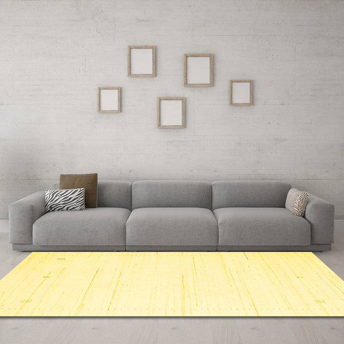 Machine Washable Solid Yellow Modern Rug in a Living Room, wshcon2343yw