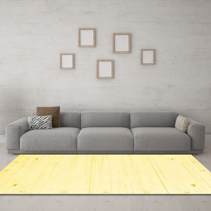 Machine Washable Solid Yellow Modern Rug in a Living Room, wshcon2344yw