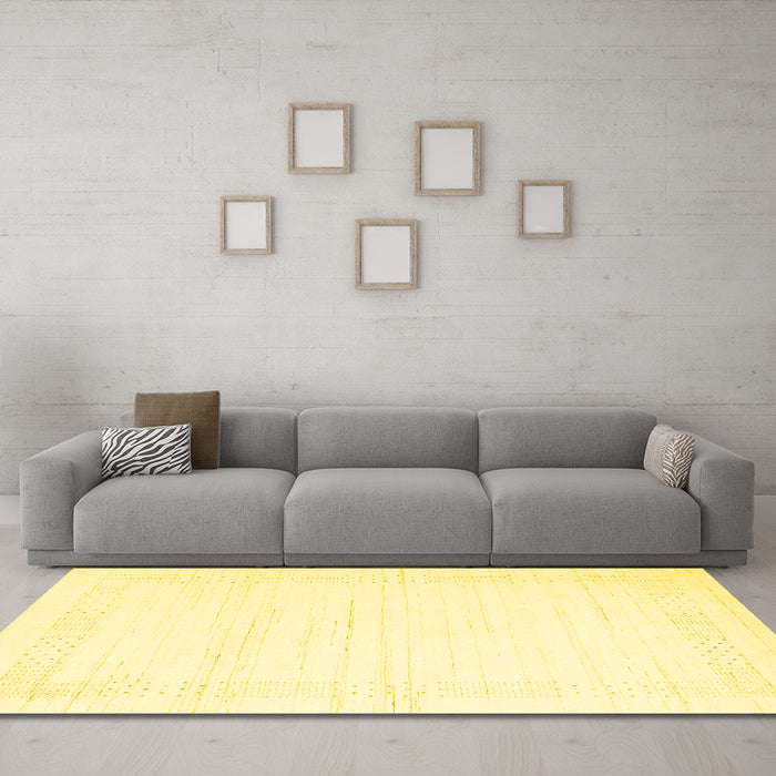Machine Washable Solid Yellow Modern Rug in a Living Room, wshcon2346yw