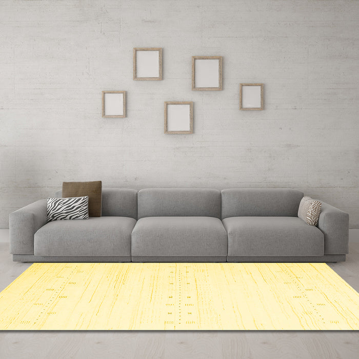 Machine Washable Solid Yellow Modern Rug in a Living Room, wshcon2365yw