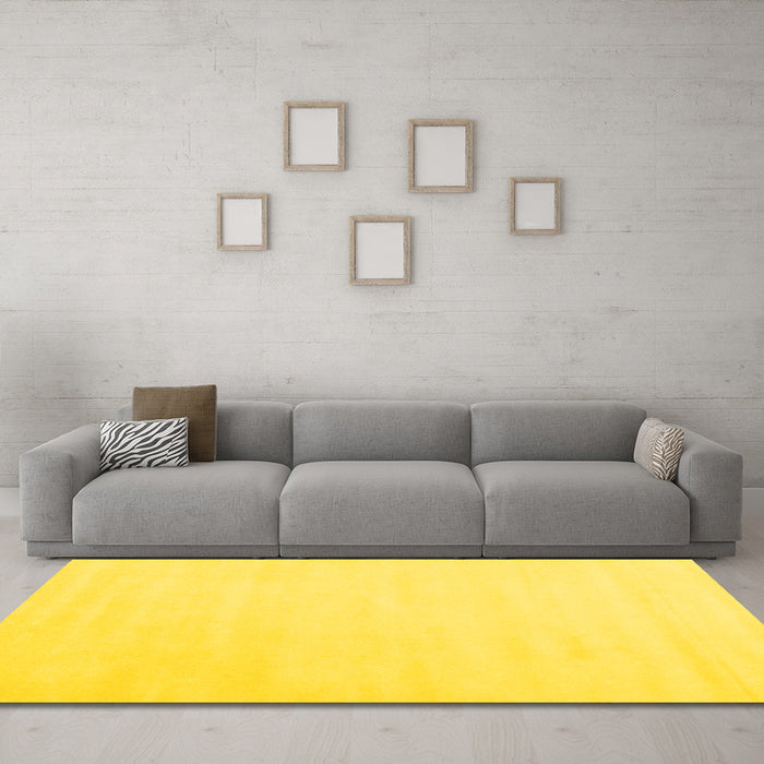 Machine Washable Solid Yellow Modern Rug in a Living Room, wshcon2373yw