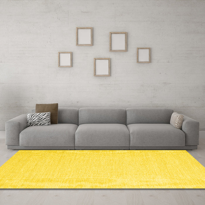 Machine Washable Solid Yellow Modern Rug in a Living Room, wshcon2409yw