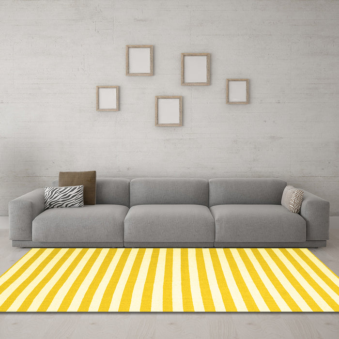 Machine Washable Solid Yellow Modern Rug in a Living Room, wshcon2414yw
