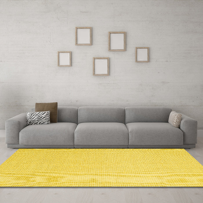 Machine Washable Solid Yellow Modern Rug in a Living Room, wshcon2419yw