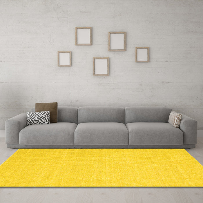 Machine Washable Solid Yellow Modern Rug in a Living Room, wshcon2423yw