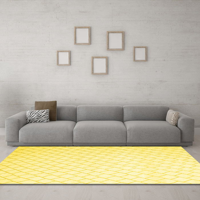 Machine Washable Solid Yellow Modern Rug in a Living Room, wshcon2431yw