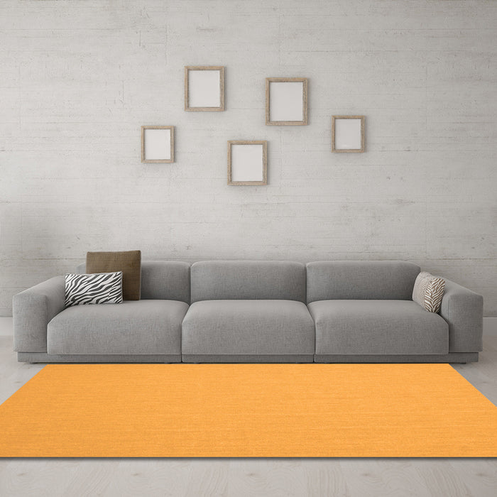Machine Washable Solid Orange Modern Area Rugs in a Living Room, wshcon243org