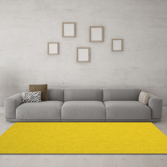 Machine Washable Solid Yellow Modern Rug in a Living Room, wshcon243yw
