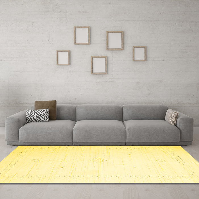 Machine Washable Solid Yellow Modern Rug in a Living Room, wshcon2443yw