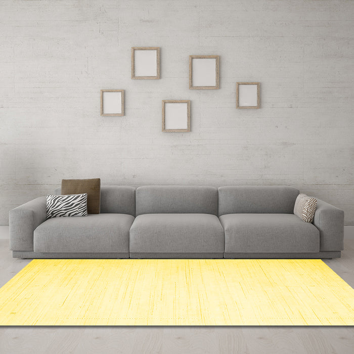 Machine Washable Solid Yellow Modern Rug in a Living Room, wshcon2444yw