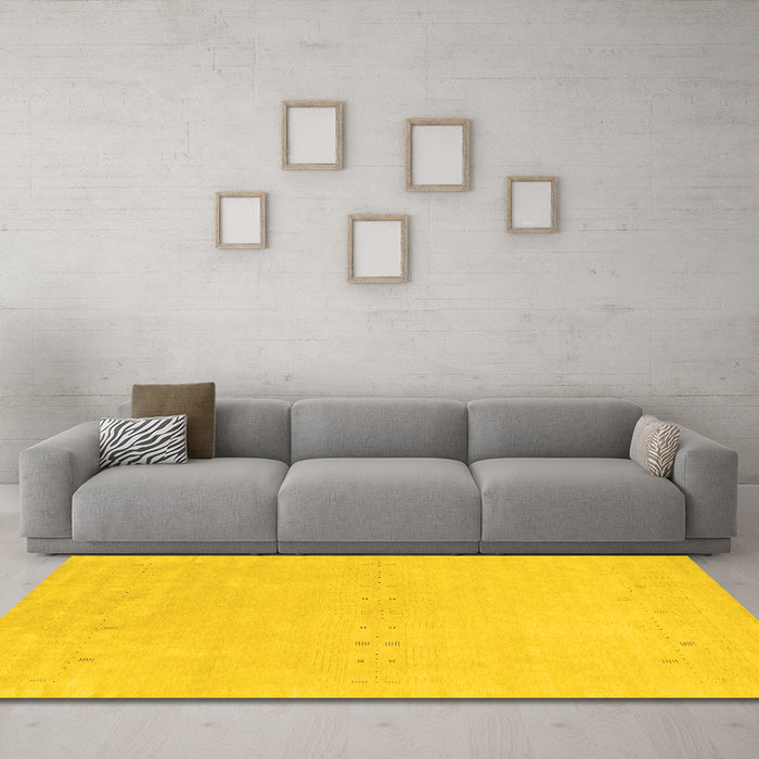 Machine Washable Solid Yellow Modern Rug in a Living Room, wshcon2457yw