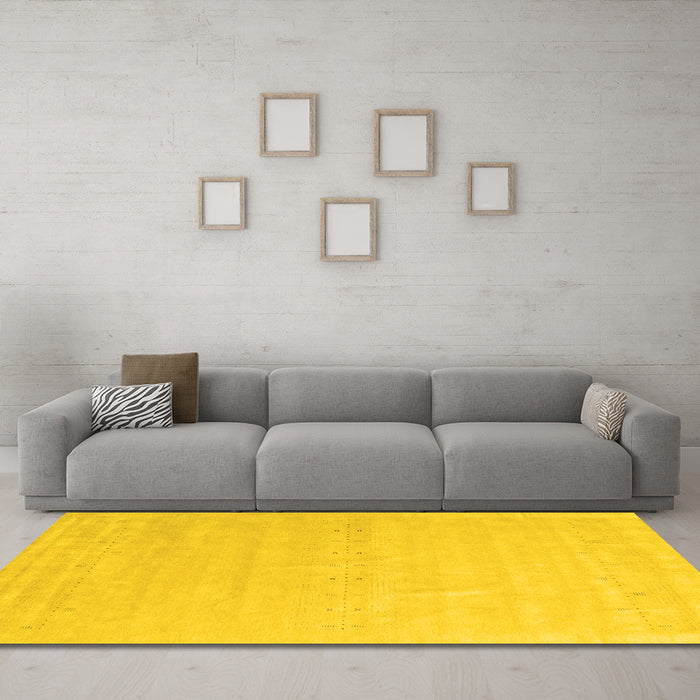 Machine Washable Solid Yellow Modern Rug in a Living Room, wshcon2461yw