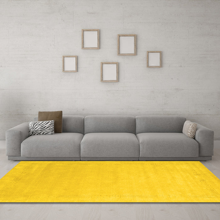 Machine Washable Solid Yellow Modern Rug in a Living Room, wshcon2462yw