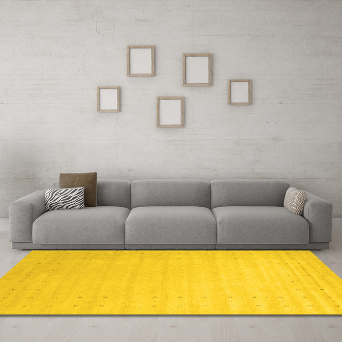Machine Washable Solid Yellow Modern Rug in a Living Room, wshcon2463yw