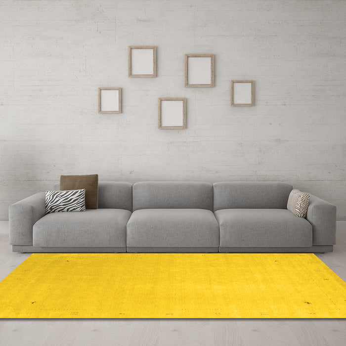 Machine Washable Solid Yellow Modern Rug in a Living Room, wshcon2464yw