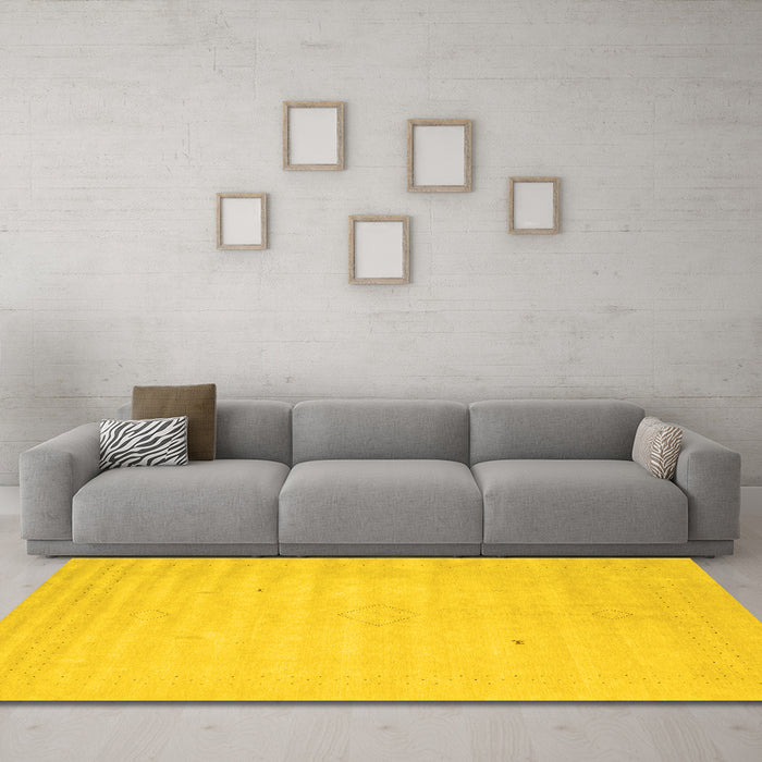Machine Washable Solid Yellow Modern Rug in a Living Room, wshcon2465yw