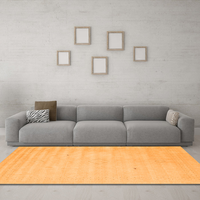Machine Washable Solid Orange Modern Area Rugs in a Living Room, wshcon2465org