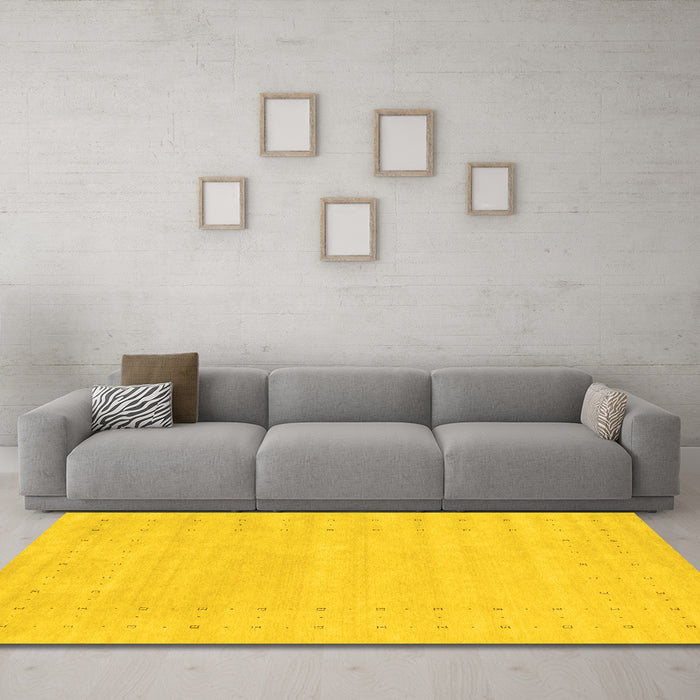 Machine Washable Solid Yellow Modern Rug in a Living Room, wshcon2479yw