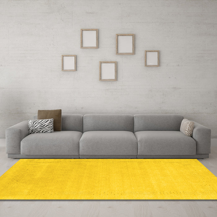 Machine Washable Solid Yellow Modern Rug in a Living Room, wshcon2480yw