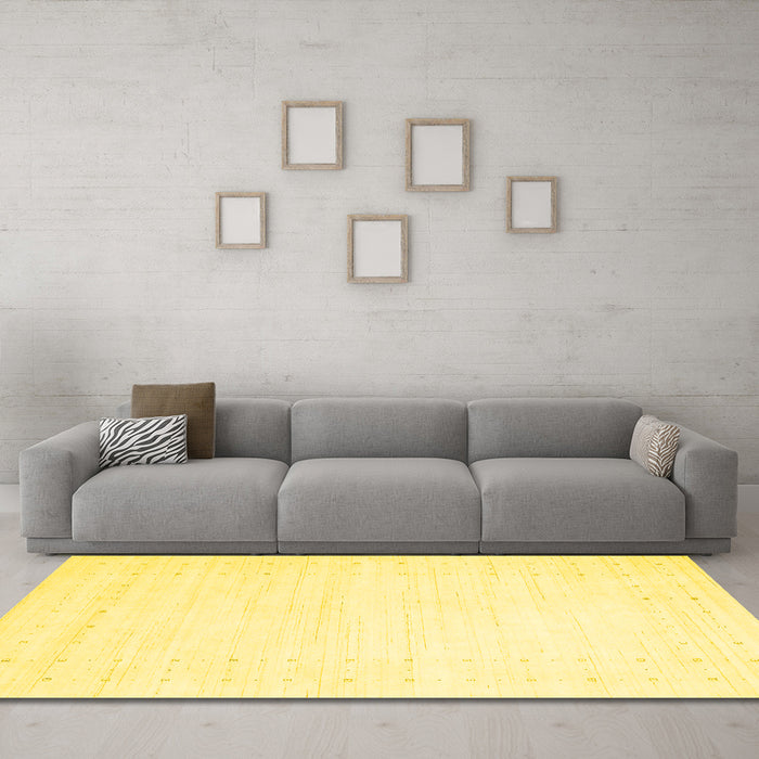 Machine Washable Solid Yellow Modern Rug in a Living Room, wshcon2481yw