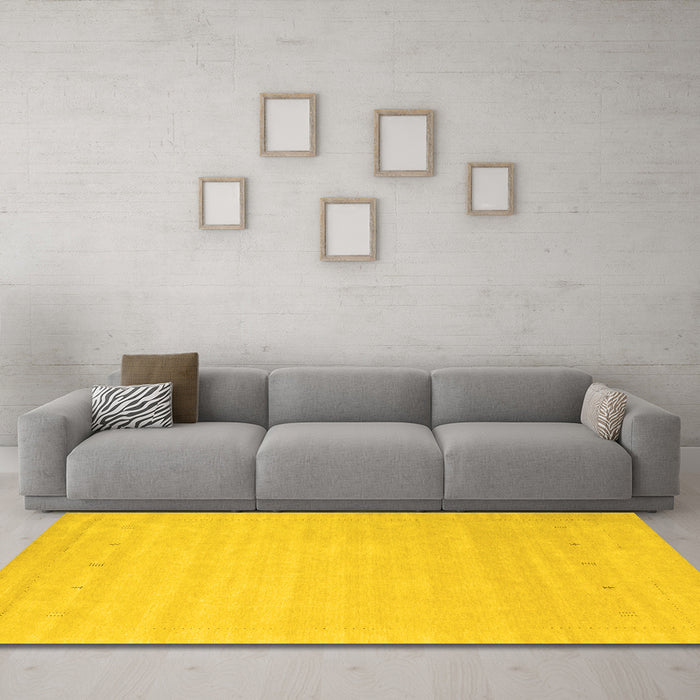 Machine Washable Solid Yellow Modern Rug in a Living Room, wshcon2486yw