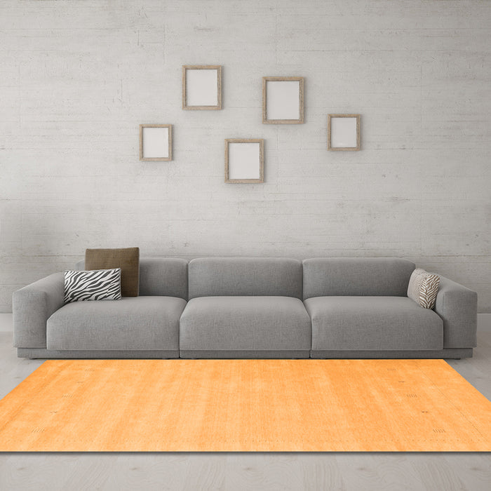Machine Washable Solid Orange Modern Area Rugs in a Living Room, wshcon2486org