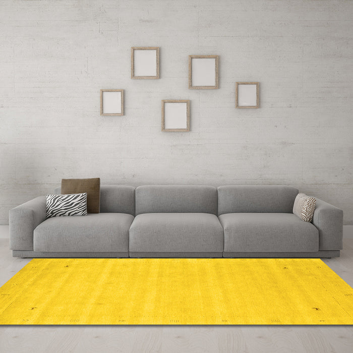 Machine Washable Solid Yellow Modern Rug in a Living Room, wshcon2487yw
