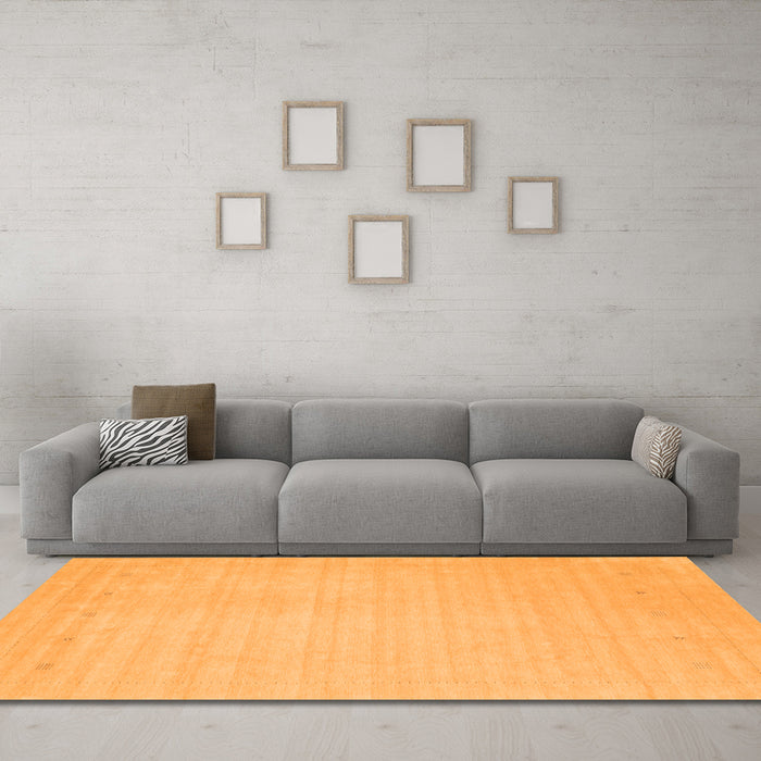 Machine Washable Solid Orange Modern Area Rugs in a Living Room, wshcon2488org