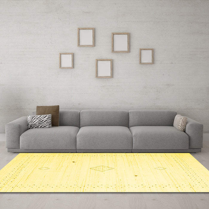 Machine Washable Solid Yellow Modern Rug in a Living Room, wshcon2496yw