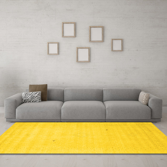 Machine Washable Solid Yellow Modern Rug in a Living Room, wshcon2498yw