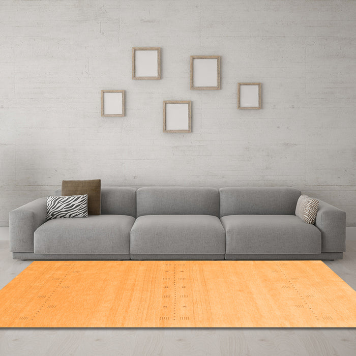 Machine Washable Solid Orange Modern Area Rugs in a Living Room, wshcon2500org